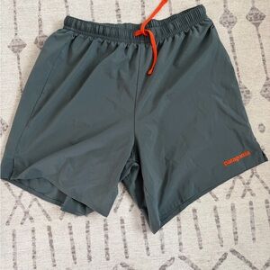 Patagonia Dark Gray Shorts with Bright Orange Accents